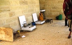 Two small cook-tops used in the preparing of food for 360 refugees living in a hallway.