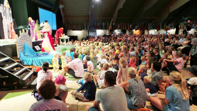 The children gathered to watch a play with Biblical motif